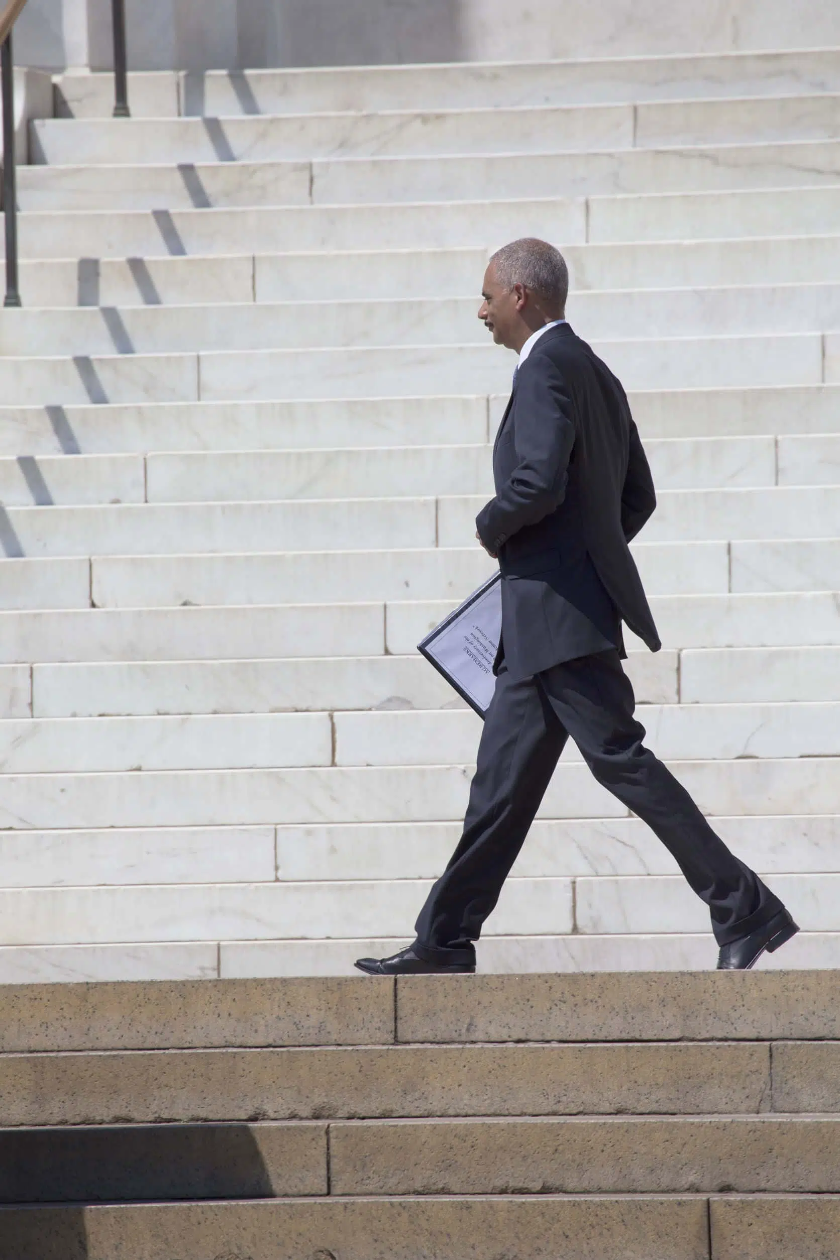 Eric Holder walking like a former attorney general boss