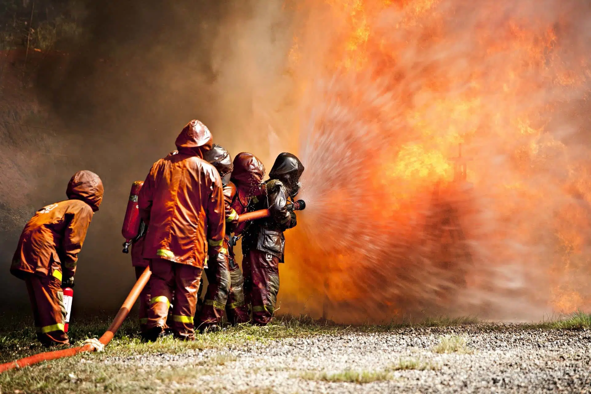 Image of firefighters attempting to extinguish a fire