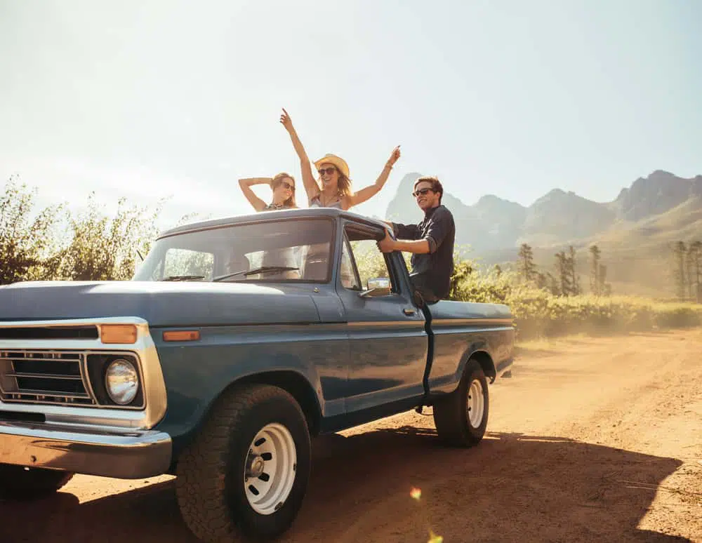 Image of teenagers dancing in the bed of a pickup truck