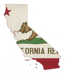 Image of the outline of the state of California, which may become a sanctuary state, with the state flag within its border